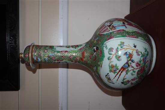 A large Chinese famille rose bottled vase and cover, mid 19th century (restored) height 46cm